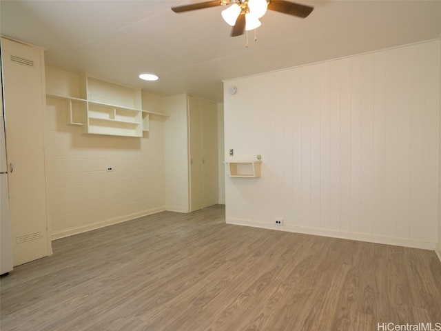 spare room featuring hardwood / wood-style floors and ceiling fan