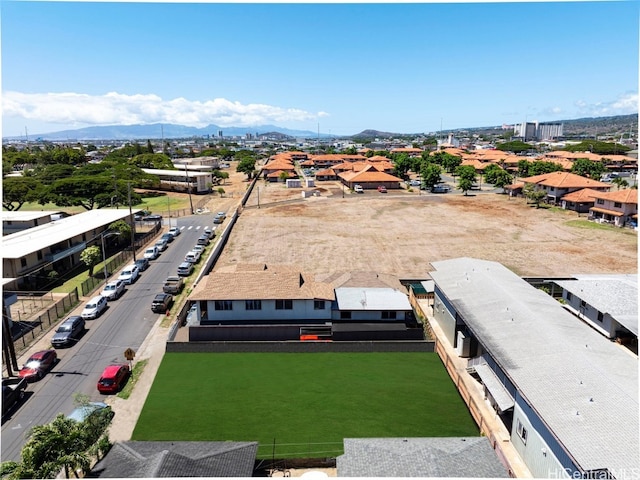 birds eye view of property with a mountain view