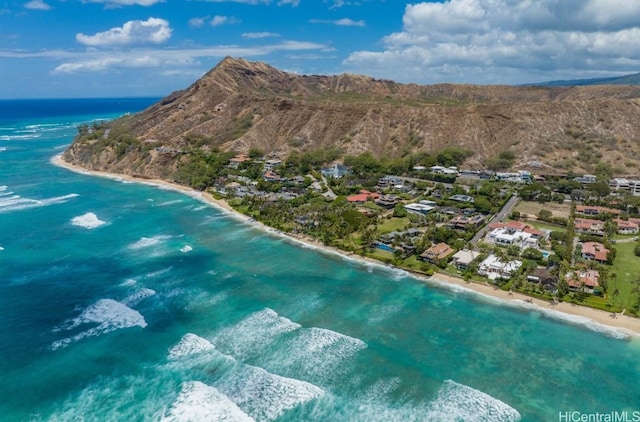 birds eye view of property with a beach view and a water and mountain view