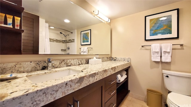 bathroom featuring toilet, a shower with curtain, vanity, and tile patterned flooring