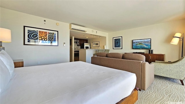 bedroom with stainless steel fridge with ice dispenser, light hardwood / wood-style flooring, and a wall mounted air conditioner