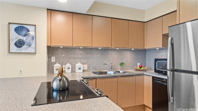 kitchen featuring sink, black appliances, light brown cabinets, and backsplash