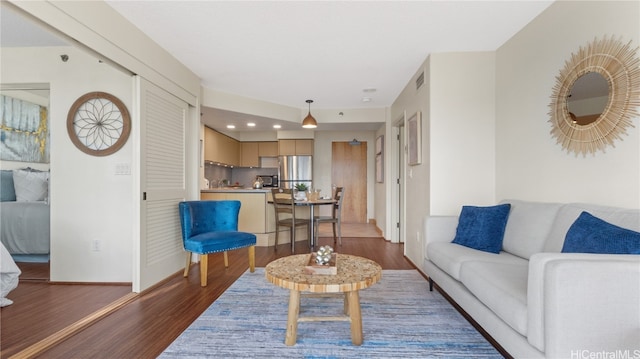 living room with dark hardwood / wood-style floors