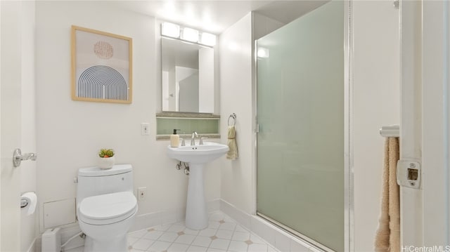 bathroom with toilet, tile patterned flooring, sink, and a shower with door