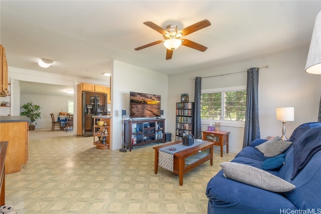 living room featuring light parquet flooring and ceiling fan