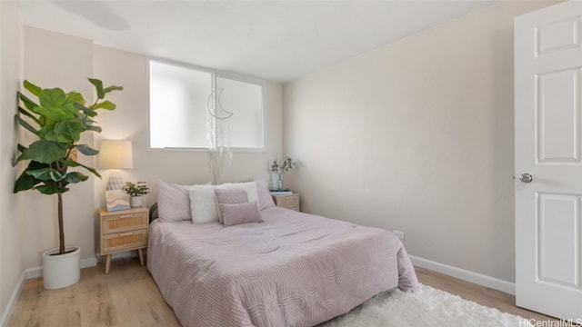 bedroom with light wood-type flooring