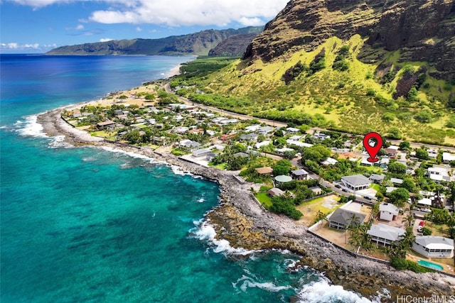 birds eye view of property featuring a water and mountain view