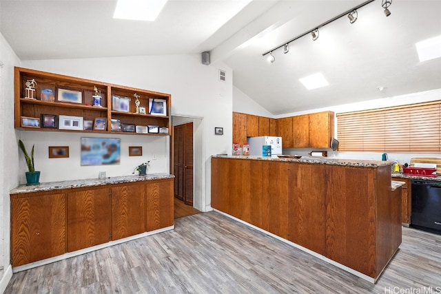 kitchen featuring dishwasher, lofted ceiling with beams, kitchen peninsula, white fridge, and light hardwood / wood-style flooring