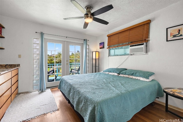 bedroom with french doors, cooling unit, dark hardwood / wood-style flooring, access to exterior, and ceiling fan