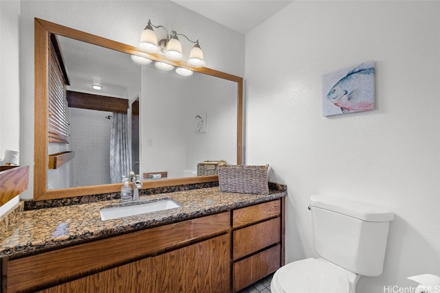 bathroom with vanity, toilet, tile patterned floors, and a shower with shower curtain