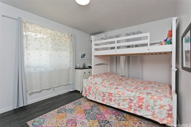 bedroom featuring dark hardwood / wood-style flooring