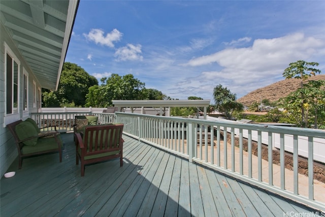 wooden deck with a mountain view