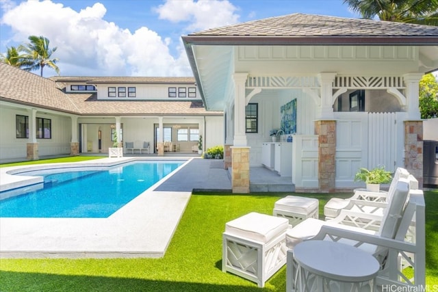 exterior space featuring a patio area and a lawn