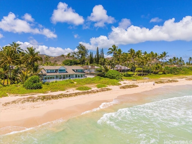 aerial view featuring a water view and a beach view