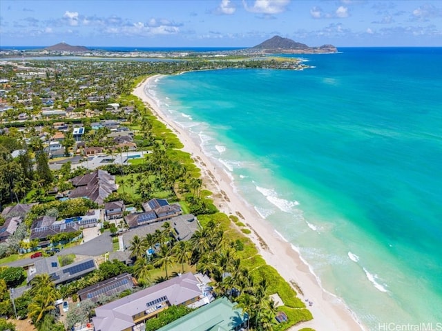 aerial view featuring a water view and a beach view