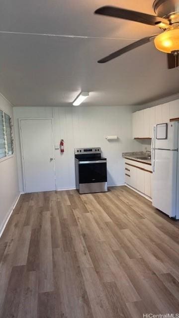 kitchen with white cabinetry, light hardwood / wood-style flooring, white refrigerator, electric stove, and ceiling fan