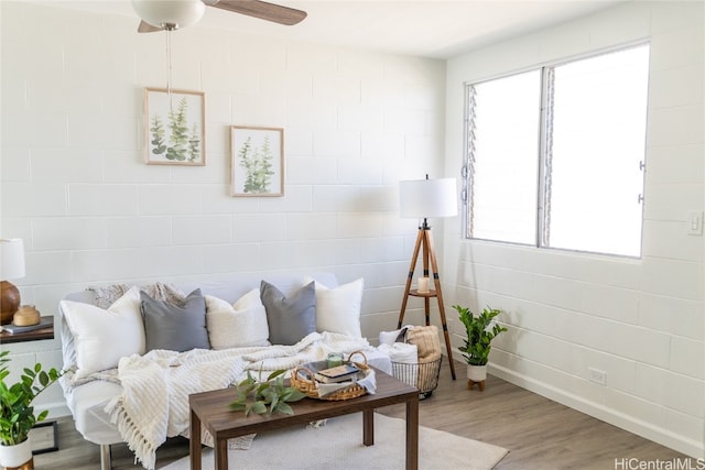 living room with a healthy amount of sunlight and hardwood / wood-style floors