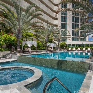 view of swimming pool with a community hot tub