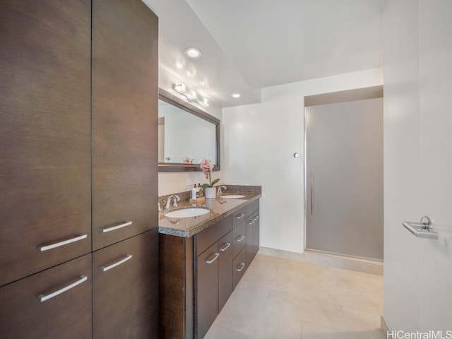 bathroom with vanity and tile patterned flooring