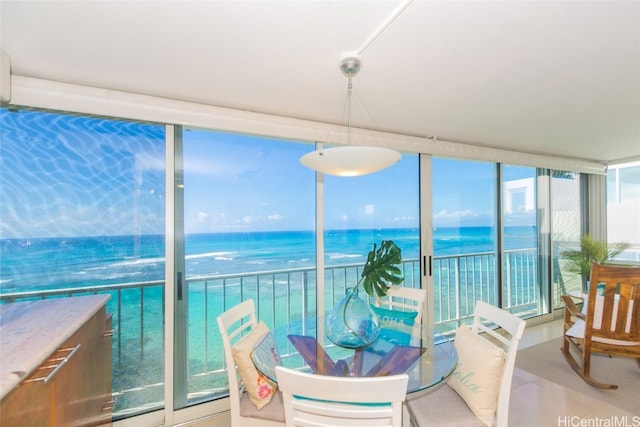 sunroom / solarium with a water view