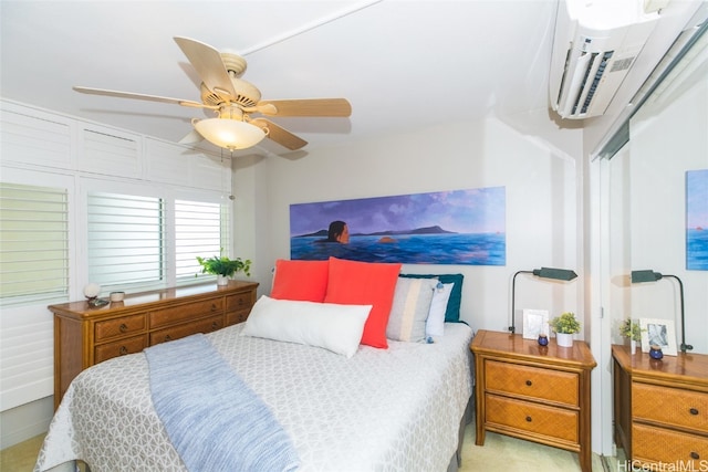 bedroom with a wall mounted air conditioner, light colored carpet, and ceiling fan