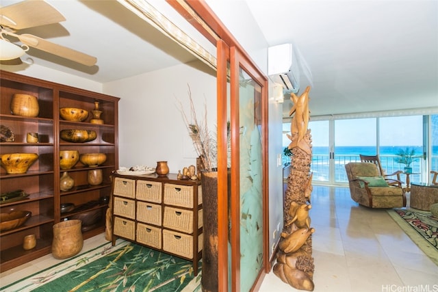 hall featuring a wall mounted air conditioner, floor to ceiling windows, a water view, and tile patterned flooring