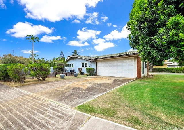 single story home with a front lawn and a garage