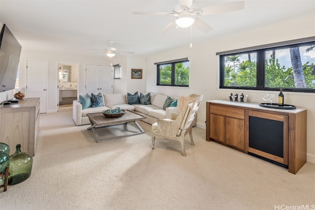 living room with light colored carpet and ceiling fan