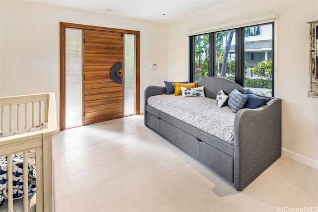 bedroom with light tile patterned floors