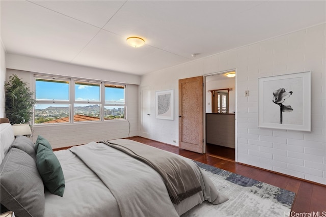 bedroom featuring dark hardwood / wood-style floors