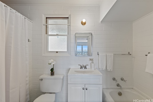 bathroom with walk in shower, vanity, and toilet