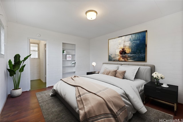 bedroom featuring dark hardwood / wood-style floors