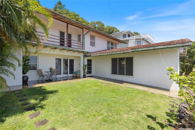 2326 Sonoma St, Honolulu, HI 96822 - rear view of property with a balcony and a lawn