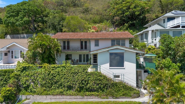 2326 Sonoma St, Honolulu, HI 96822 - back of property featuring a balcony, stairs, and stucco siding