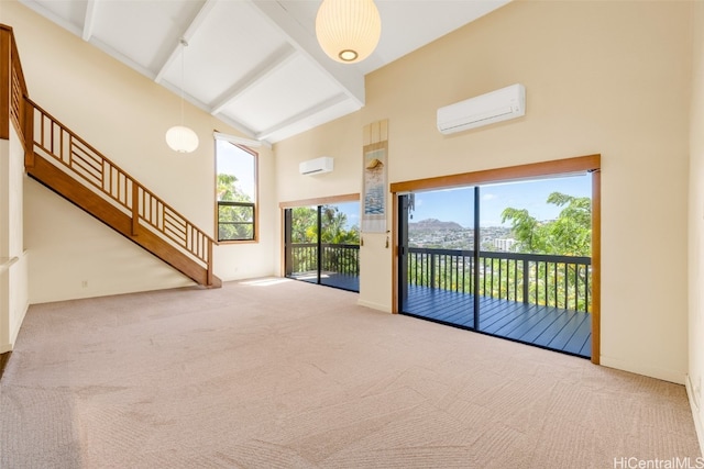 unfurnished living room featuring high vaulted ceiling, an AC wall unit, beamed ceiling, and carpet