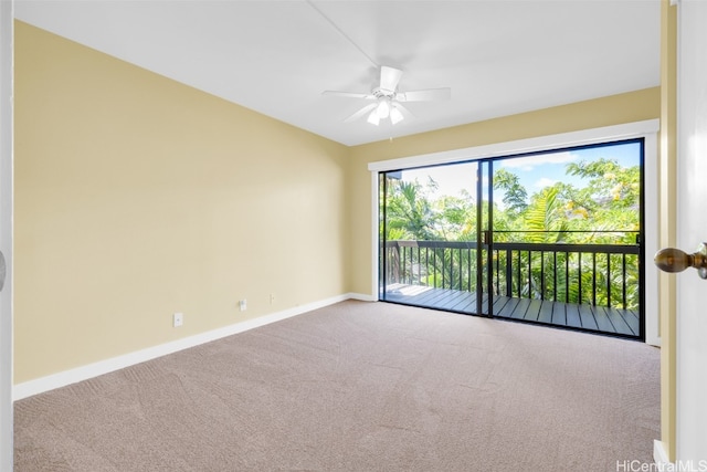 unfurnished room featuring ceiling fan and carpet