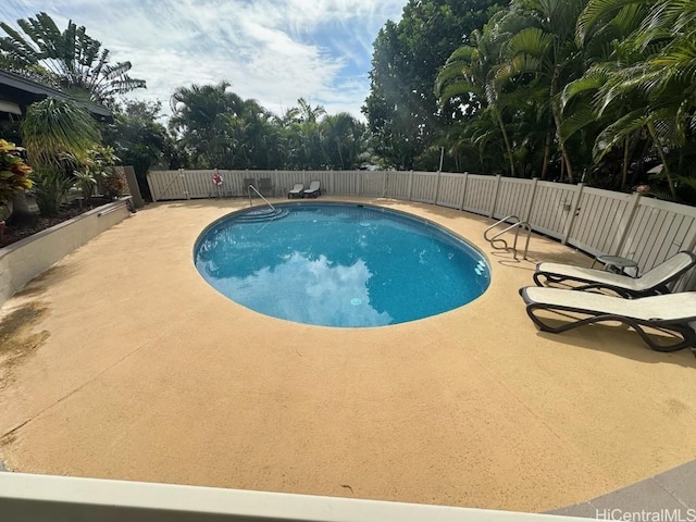 view of pool featuring a patio area