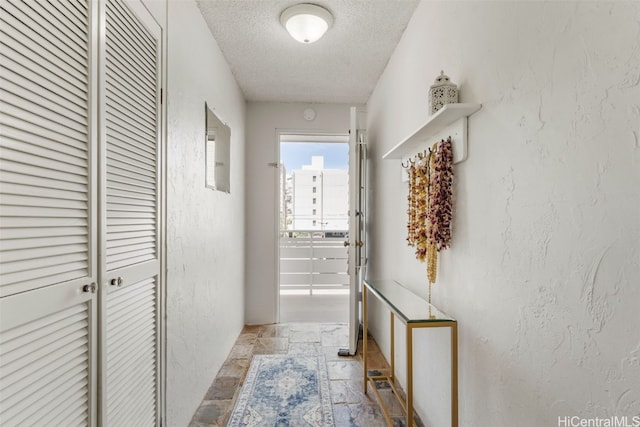 corridor with a textured ceiling