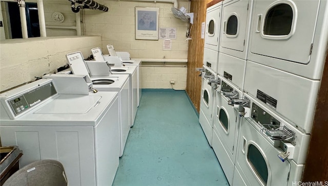 laundry area with stacked washer / drying machine and separate washer and dryer