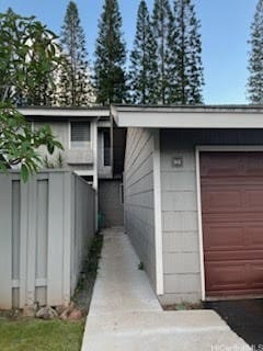 view of property exterior featuring a garage