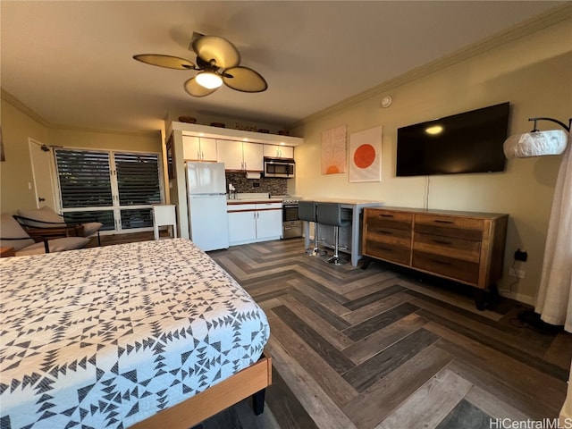 bedroom featuring ornamental molding, dark parquet floors, ceiling fan, and white fridge