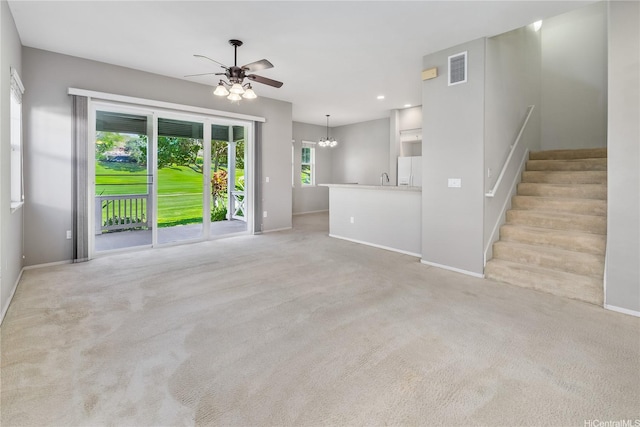 92-1180 Olani St Unit 55-1, Kapolei, HI 96707 - unfurnished living room featuring a ceiling fan, a chandelier, baseboards, stairs, and recessed lighting