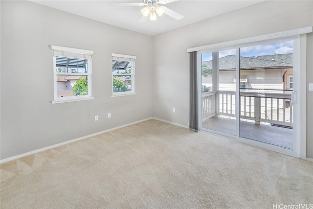 unfurnished room with carpet flooring and ceiling fan