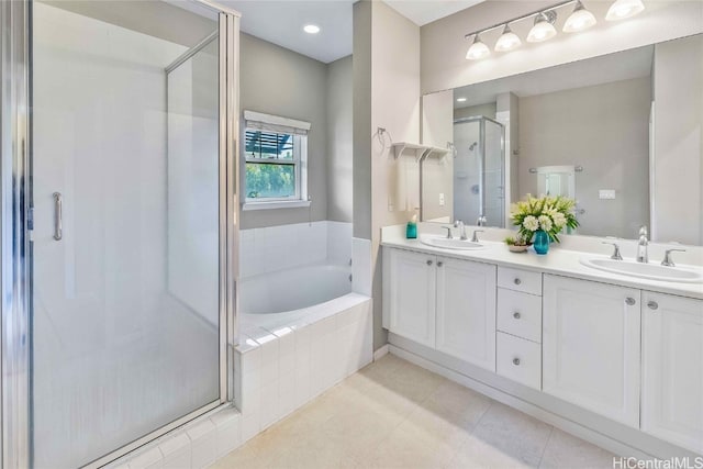 bathroom featuring vanity, tile patterned floors, and independent shower and bath