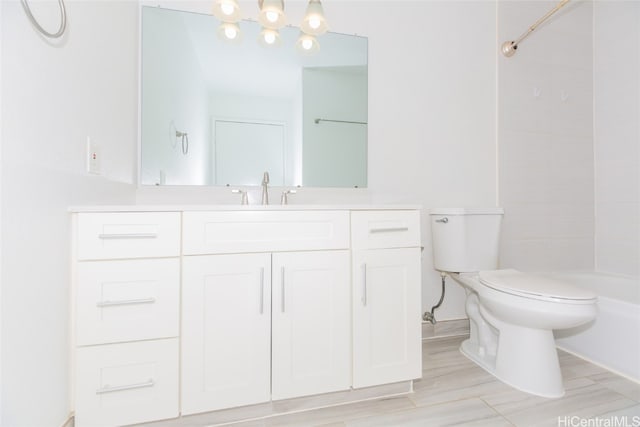 full bathroom with vanity, toilet, hardwood / wood-style flooring, and  shower combination