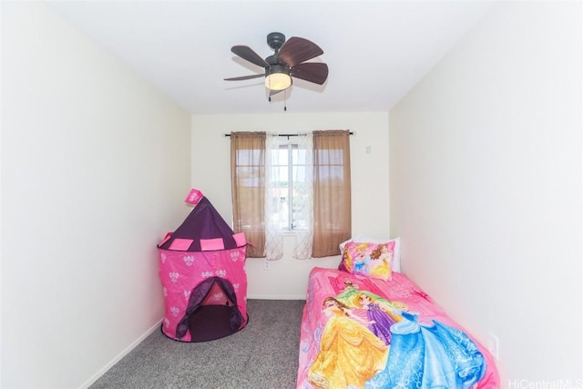 carpeted bedroom with baseboards and a ceiling fan