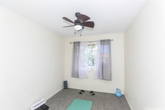 interior space featuring carpet floors, ceiling fan, and baseboards