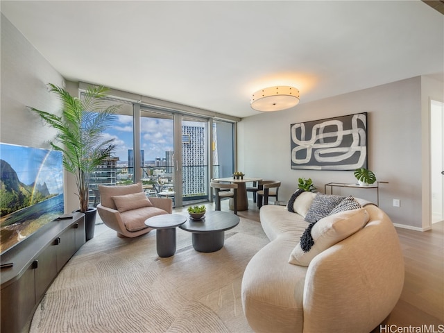 living room featuring hardwood / wood-style flooring and expansive windows