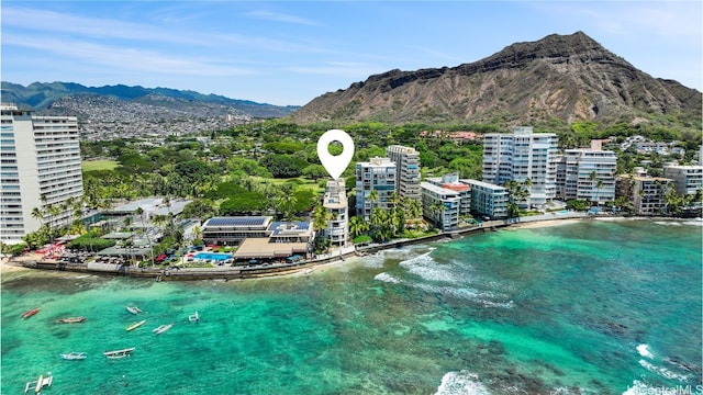 birds eye view of property featuring a water and mountain view