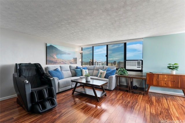 living room featuring expansive windows, cooling unit, a textured ceiling, and dark hardwood / wood-style flooring